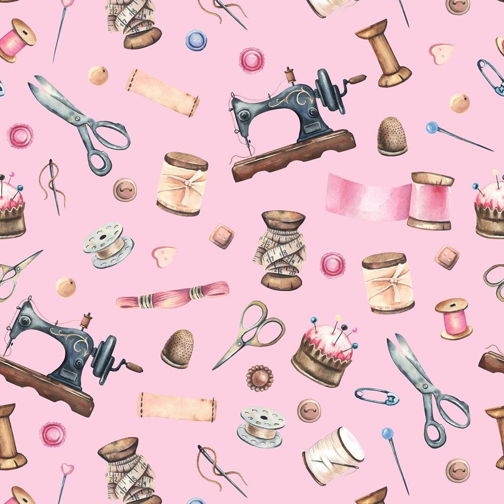 - Pink Old Sewing Elements Quilting Cotton Fabric  
- Pink background  
- Vintage sewing machines  
- Scissors  
- Spools of thread  
- Thimbles  
- Sewing pins  
- Buttons  
- Pin cushions  
- Measuring tape  
- Cotton fabric  
- Quilting material  
- Craft supplies  
- Old-fashioned sewing tools