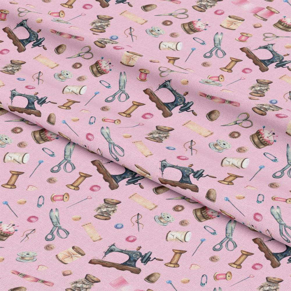 - Pink Old Sewing Elements Quilting Cotton Fabric  
- pink background  
- vintage sewing motifs  
- scissors, spools, needles  
- thread, thimbles, buttons  
- quilting, cotton material  
- craft, handmade, textile  
- pastel shades, light colors  
- nostalgic, sewing tools pattern