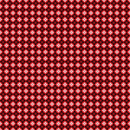 A red and black symmetrical geometric patterned fabric with circular and star-like designs repeating across the surface.