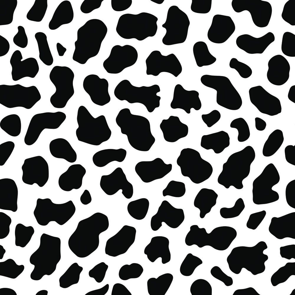 Black and white cow print pattern with irregular spots scattered across the image.