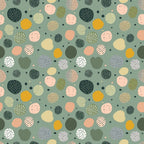 Abstract pattern of variously colored and textured circles on a green background.
