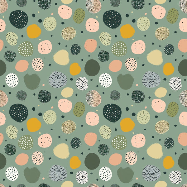 Abstract pattern of variously colored and textured circles on a green background.