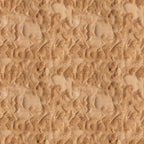 Close-up view of textured sand with ripples and small impressions, creating a wavy pattern across the surface.
