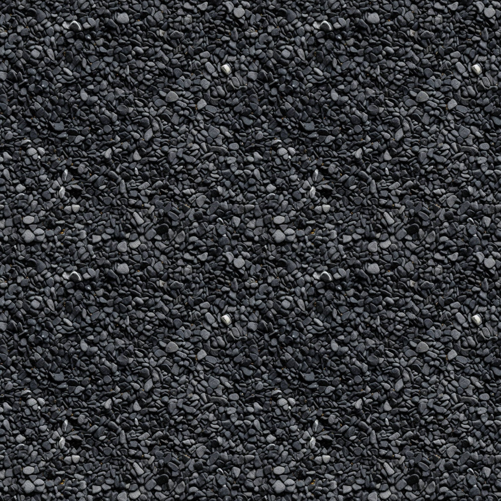 A textured surface of small, uniform dark gray stones closely packed together.