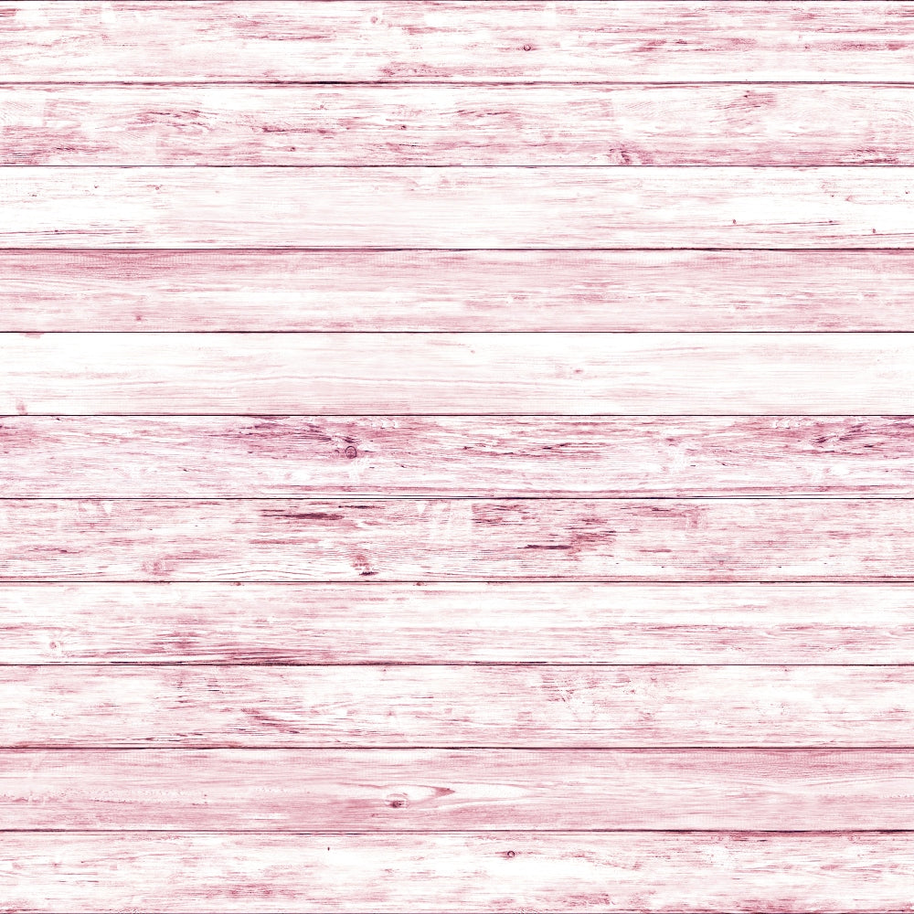 Pink-washed wooden planks arranged horizontally, showing natural grain and texture.