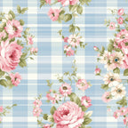 A floral pattern with pink and white flowers and green leaves on a blue and white plaid background.