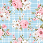 Floral pattern with pink and white flowers on a blue plaid background.