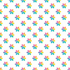 Pattern of multicolored, symmetrical floral shapes evenly spaced on a white background.