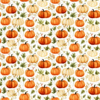 Pattern of orange and white pumpkins with green leaves and small branches on a white background.