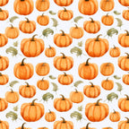 Pattern of various sized orange pumpkins and green leaves on a light background.