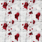 A pattern of red paint splatters on a white background, arranged in a grid layout.