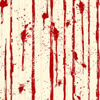Red paint drips and splatters vertically on a beige surface, creating an abstract pattern.