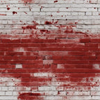 White brick wall with red paint splatters across the surface.