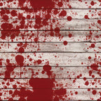 Wooden planks splattered with red paint, creating an abstract pattern.