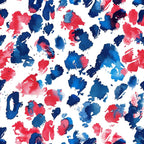 Abstract pattern of red, blue, and white paint splashes scattered randomly on a canvas.