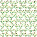 A repeating geometric pattern with green and beige floral designs forming diamond shapes.