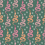 Pattern of pink and orange snakes with flowers and stars on a green background.