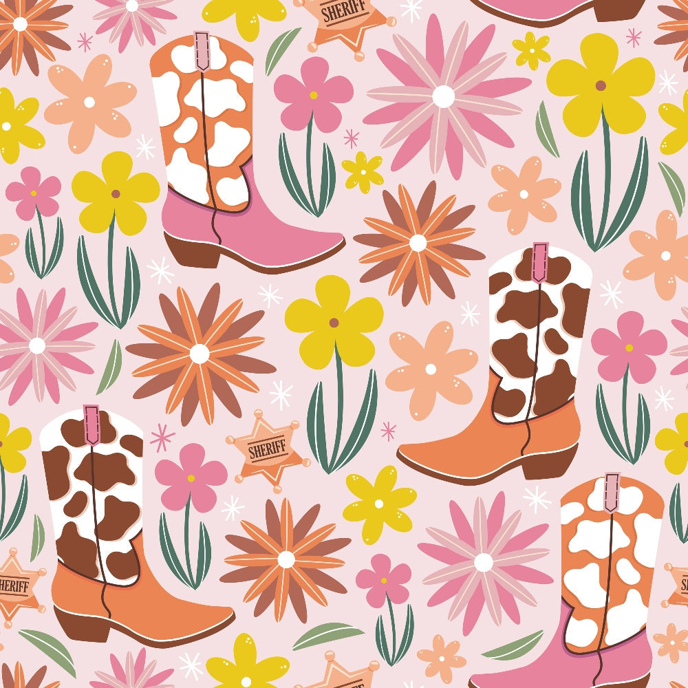 Pattern of cow-print cowboy boots, yellow and pink flowers, green leaves, and sheriff badges on a pink background.