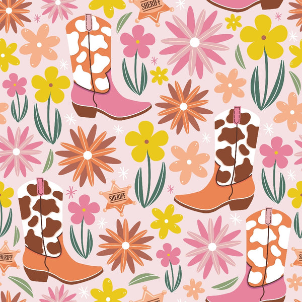Pattern of cow-print cowboy boots, yellow and pink flowers, green leaves, and sheriff badges on a pink background.