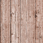 Close-up of vertical brown wooden planks with visible grain and knots, creating a rustic texture.