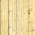 Wooden planks with a light yellowish tint, showing vertical grain patterns, knots, and visible textures.