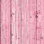Pink wooden planks with visible grain and knots, arranged vertically.