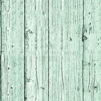 Weathered green wooden planks with vertical lines and visible knots.