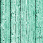 Green wooden planks with vertical grain and visible knots.