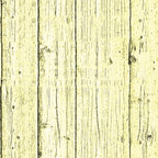 A close-up of light yellow wooden planks with visible grain and knots. The planks are aligned vertically, showing a natural texture and subtle variations in shading.