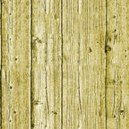 Wooden fence with vertical slats, aged appearance, and natural knots. The wood has a yellowish tint and visible grain patterns.